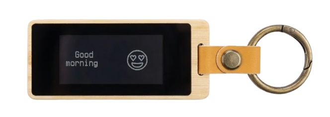 Front of a KEEP bamboo keychain — its e-ink screen showing a good-morning note.